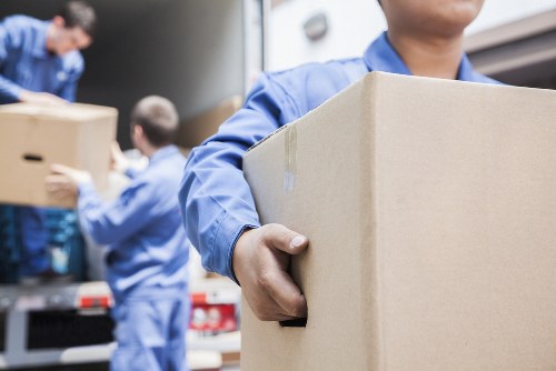 Team members reviewing ethical labour standards for Removal Company Nottinghill