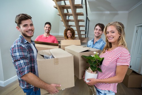 Removal crew handling furniture carefully during transport