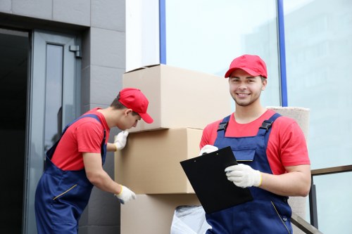 Professional movers handling belongings in a Notting Hill property