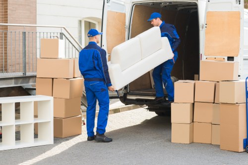 Staff organizing equipment for an office move in Nottinghill