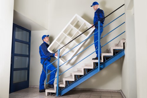Removal staff keeping walkways clear during a property move