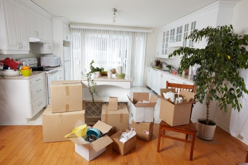 Organised moving boxes and protective packing materials ready for collection