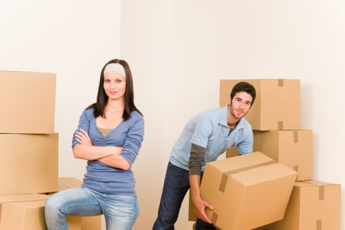 Professional movers packing household items for a Nottinghill move