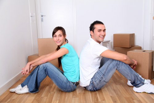 Removal van and movers handling furniture for a local flat move