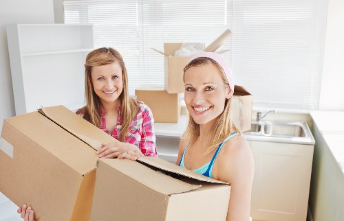 Trained movers handling furniture carefully during a Notting Hill relocation