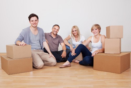 Professional movers loading items into a removal van in Notting Hill